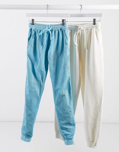 Pantaloni della tuta con fondo elasticizzato e strato superiore in rete in coordinato - Criminal Damage - Modalova
