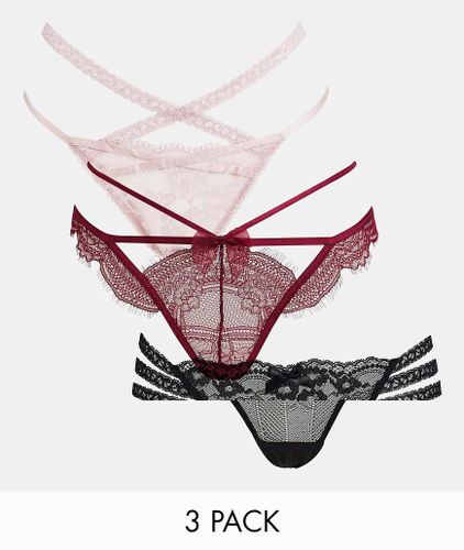 Tora - Confezione da 3 perizomi in pizzo a fascette rosa, rosso e nero-Multicolore - Hunkemoller - Modalova